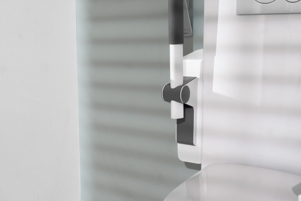 Close-up of Ropox toilet lifter wall bracket and height adjustment mechanism