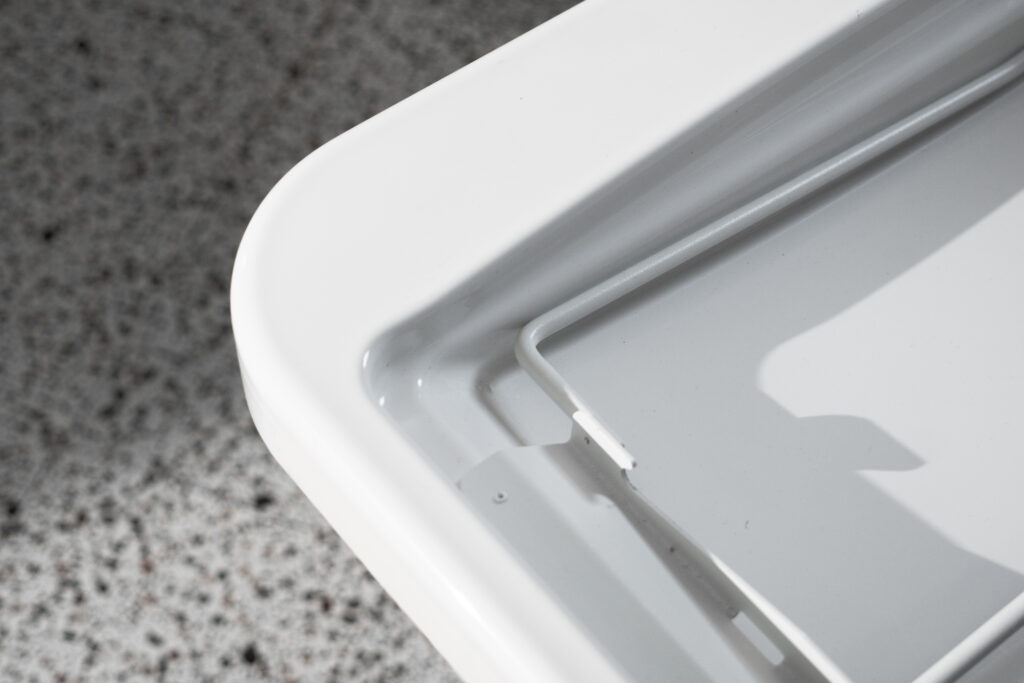 Close-up of the rounded corner and safety rail detail on Ropox shower bed
