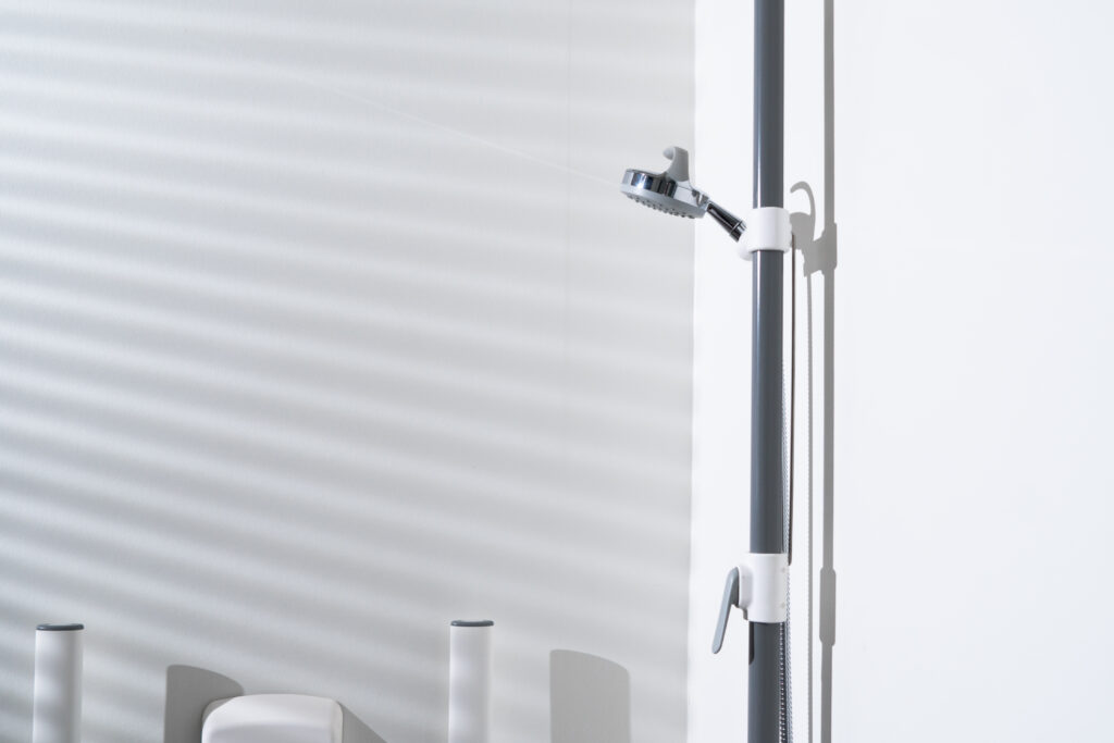 Close-up of Ropox shower grab bar wall mounting.