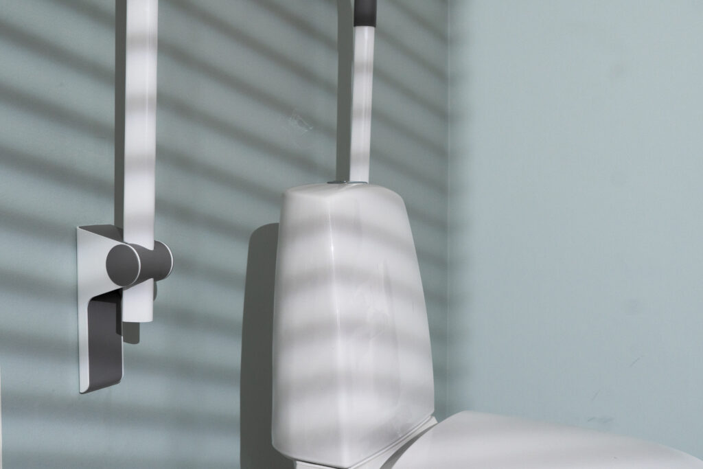 toilet support arms with user