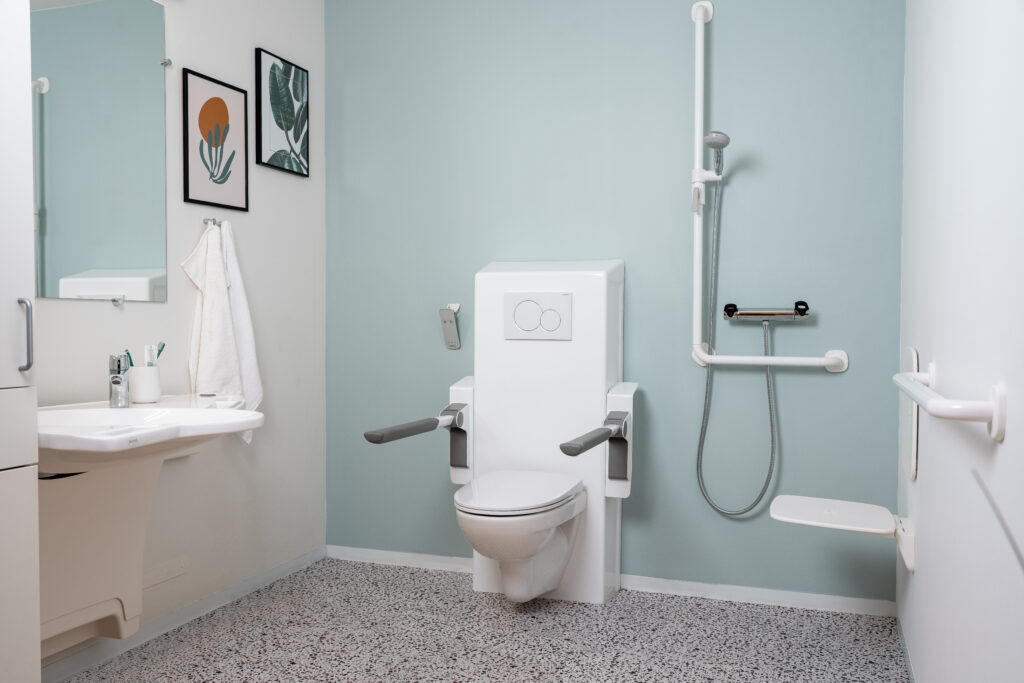 DuraMini shower seat in an accessible bathroom